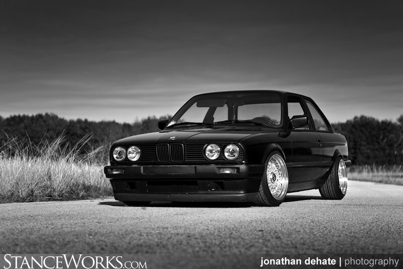 black bmw e30 on road