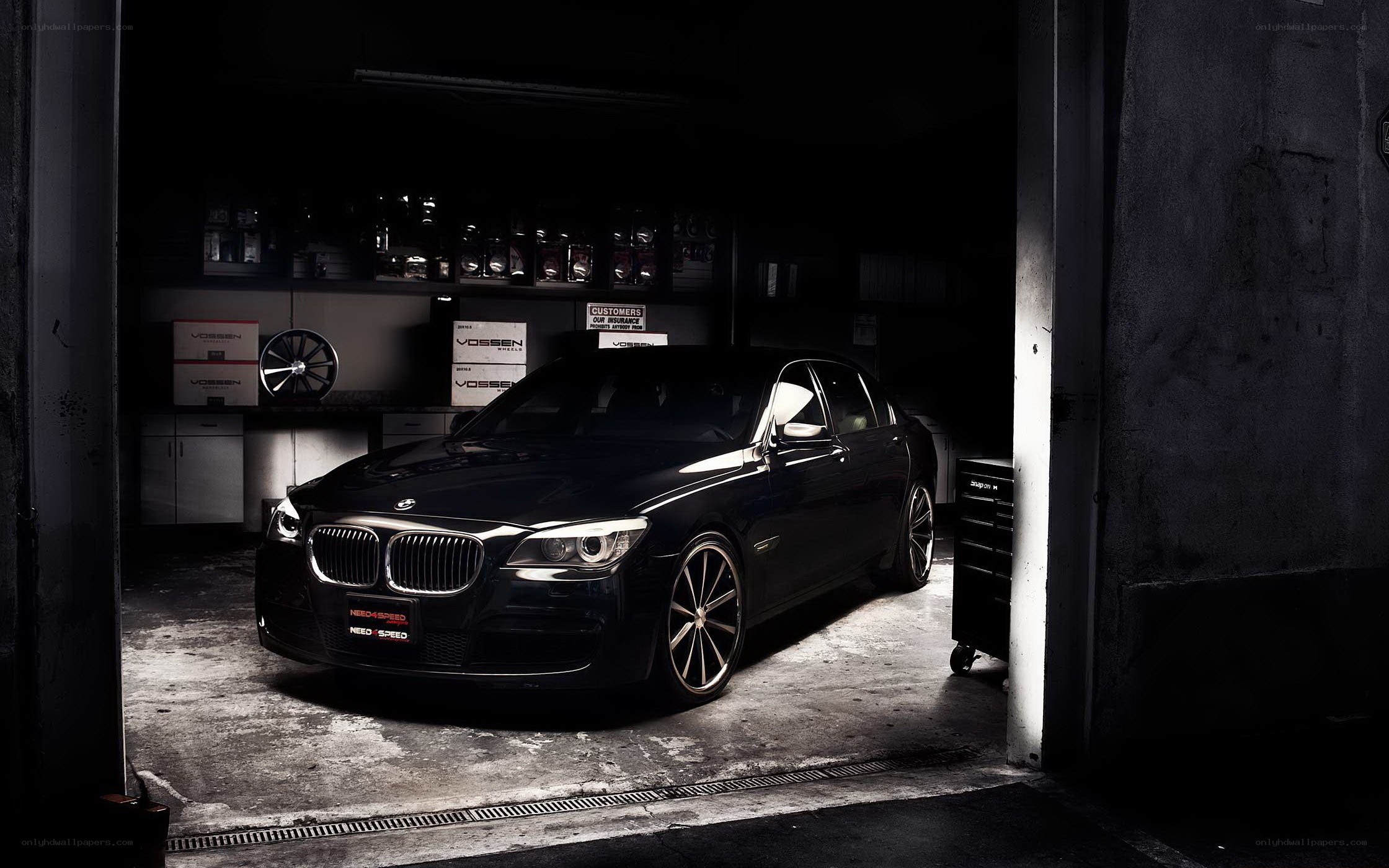 Black BMW in a garage