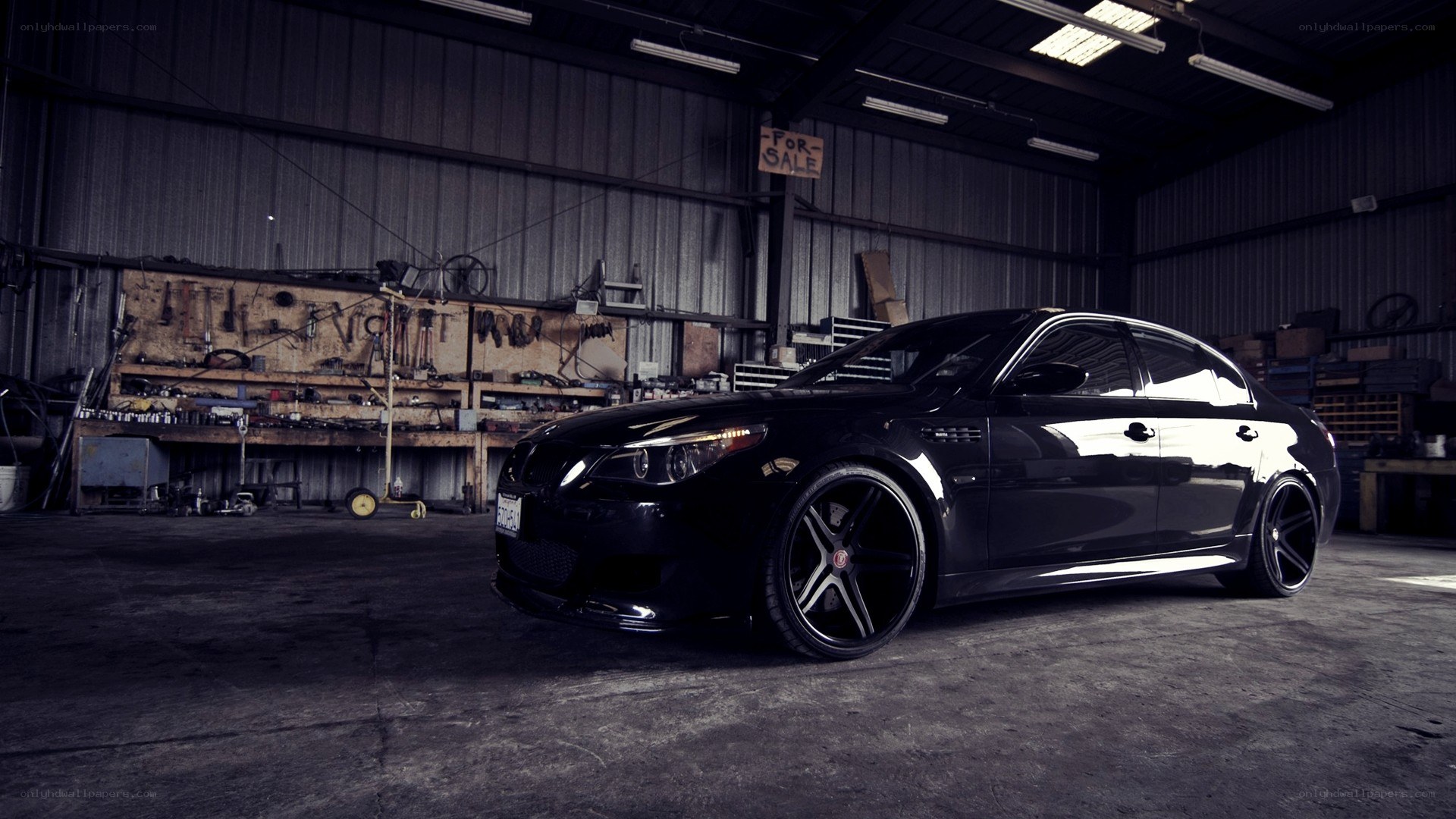 Black BMW in a garage