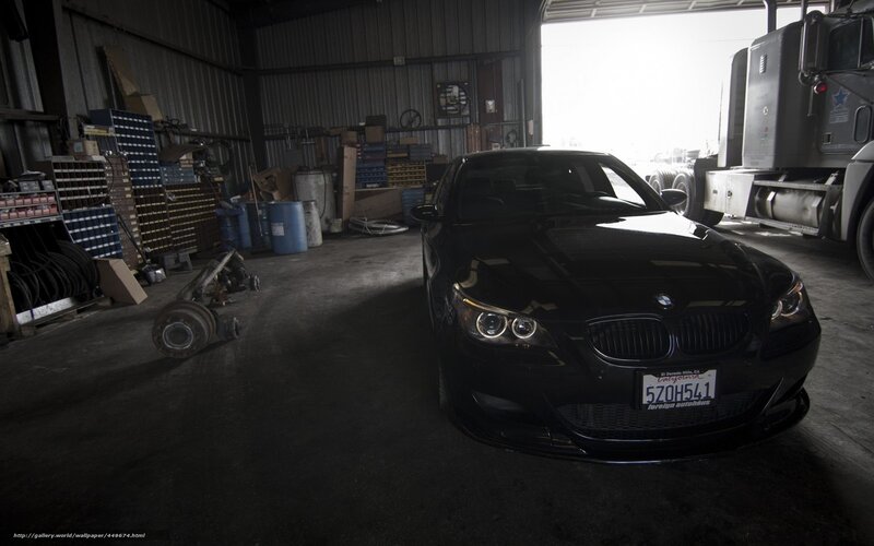 Black BMW in a garage