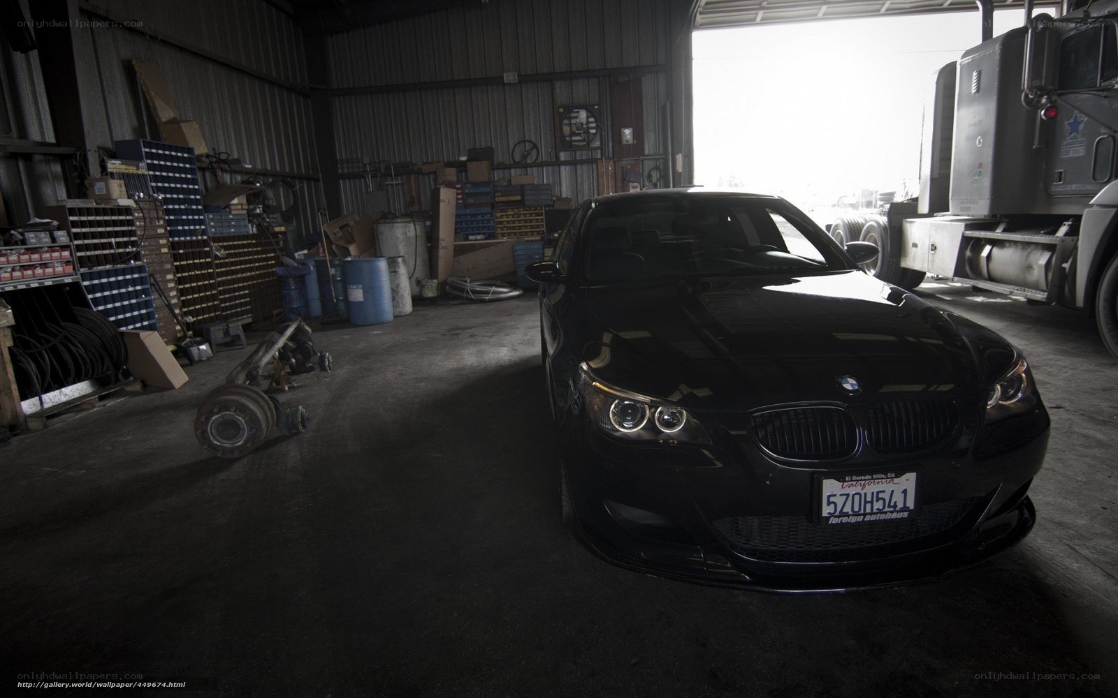Black BMW in a garage