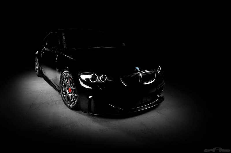 black bmw in dark studio