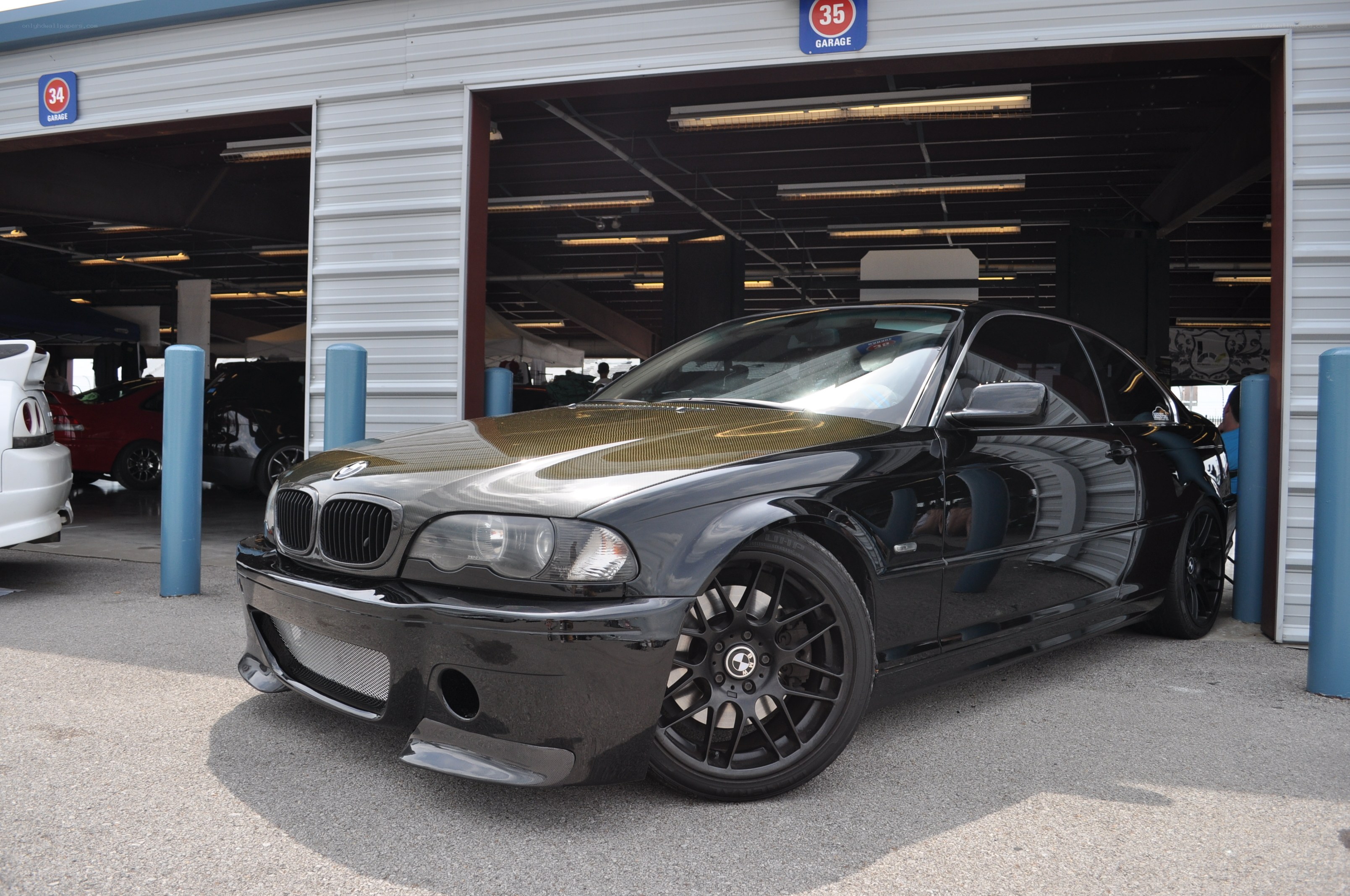 Black BMW in garage