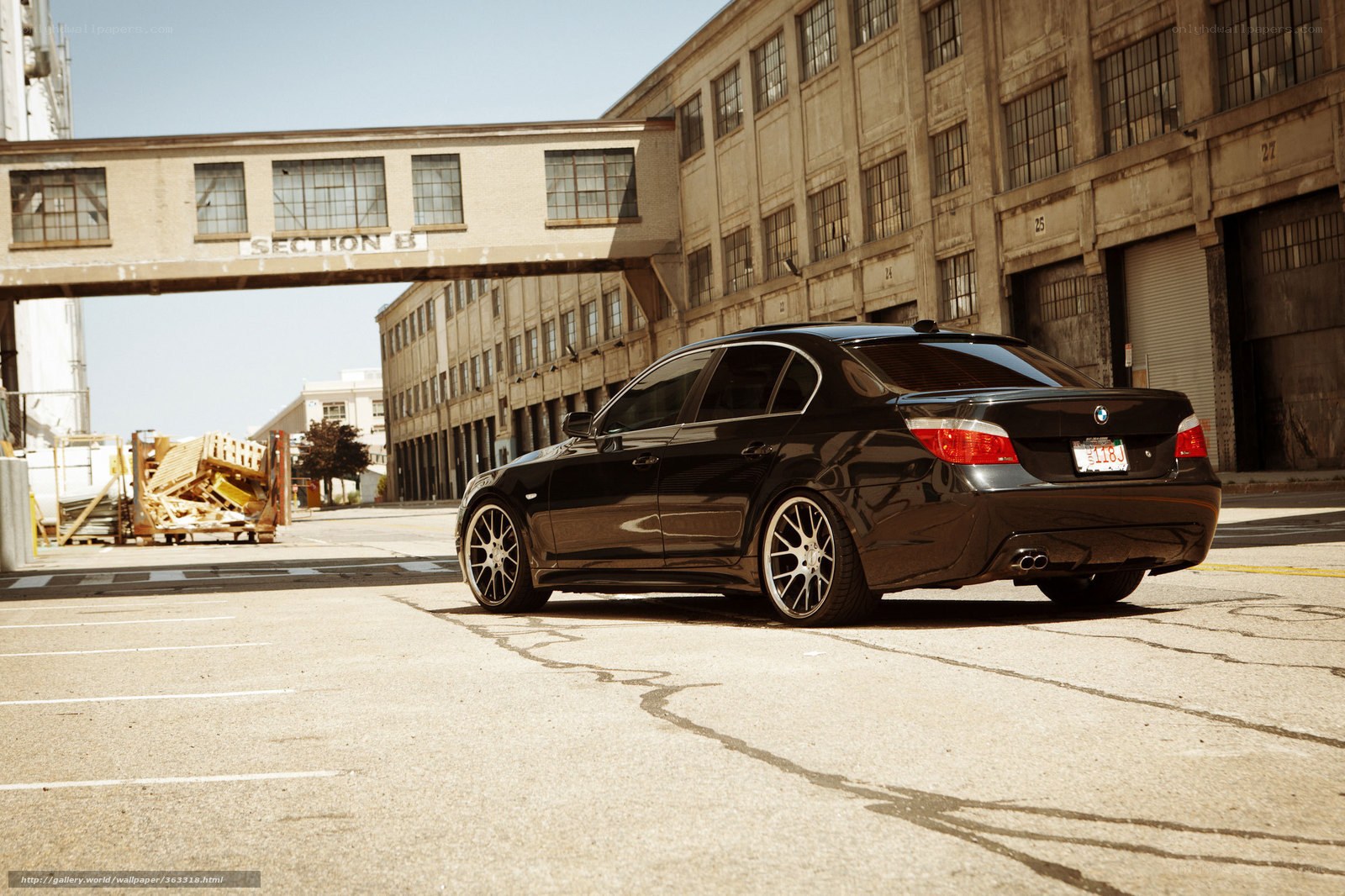 Black BMW in industrial lot
