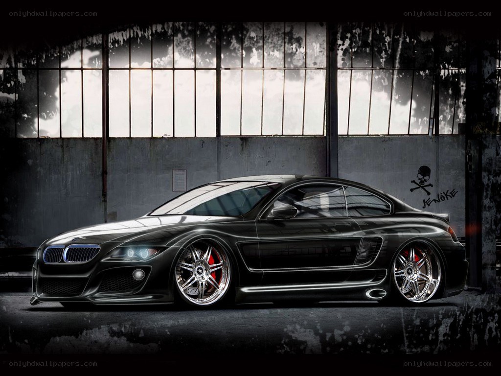 Black BMW in industrial setting