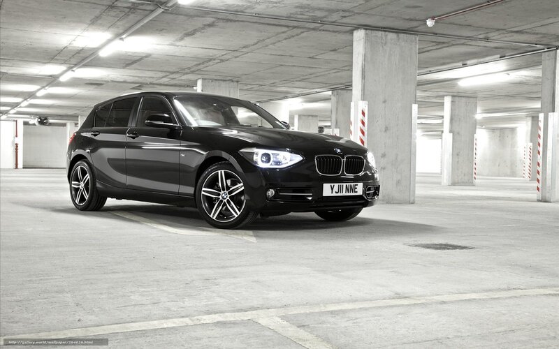 Black BMW in parking garage