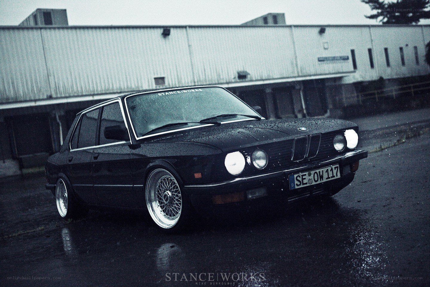 Black BMW in the rain