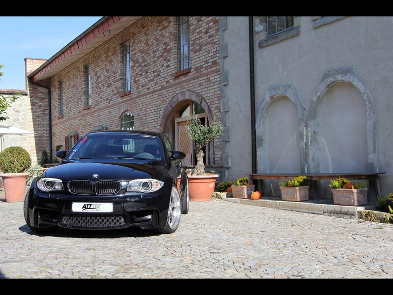Black BMW M135i in courtyard