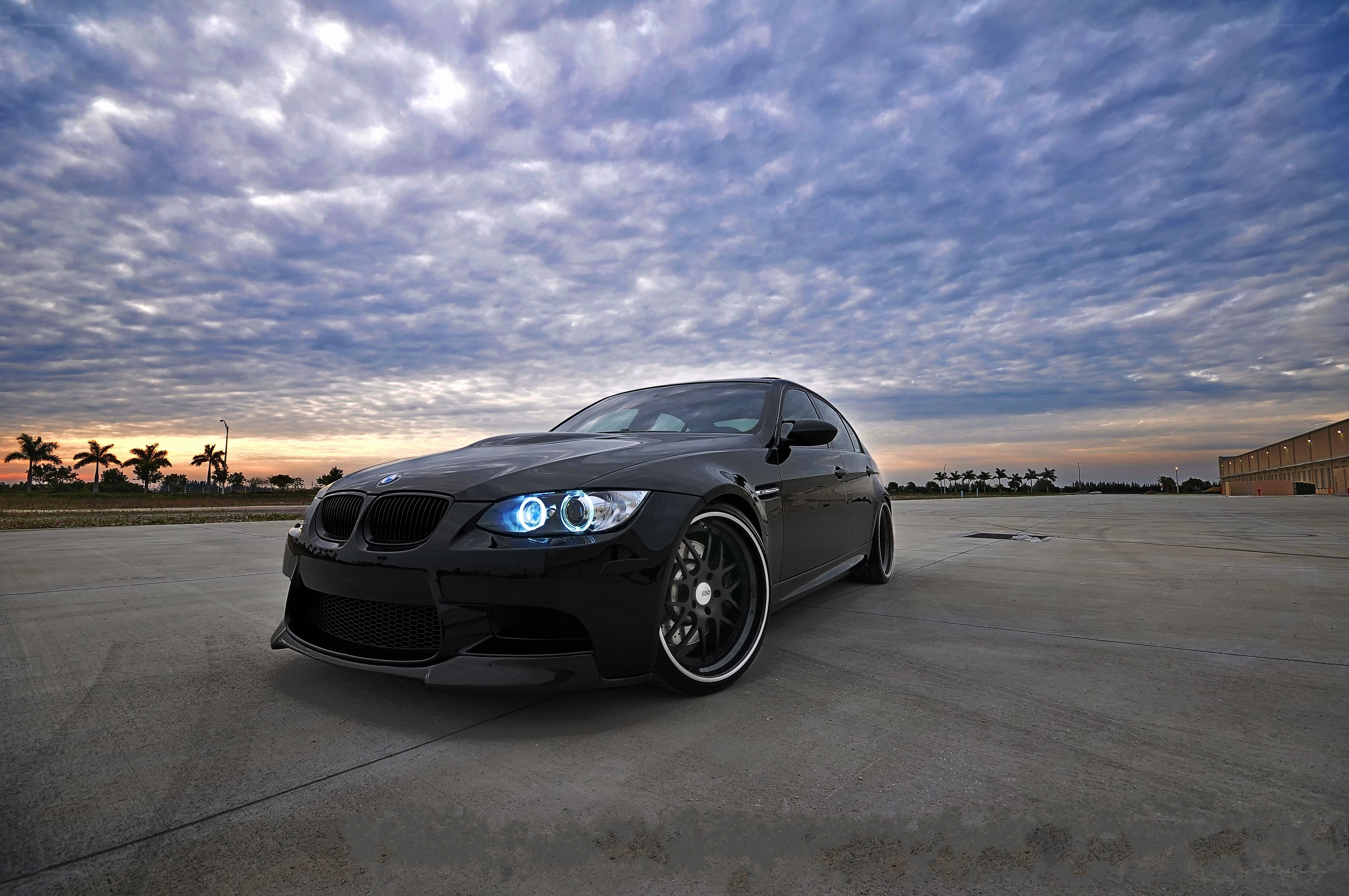Black BMW M3 at sunset
