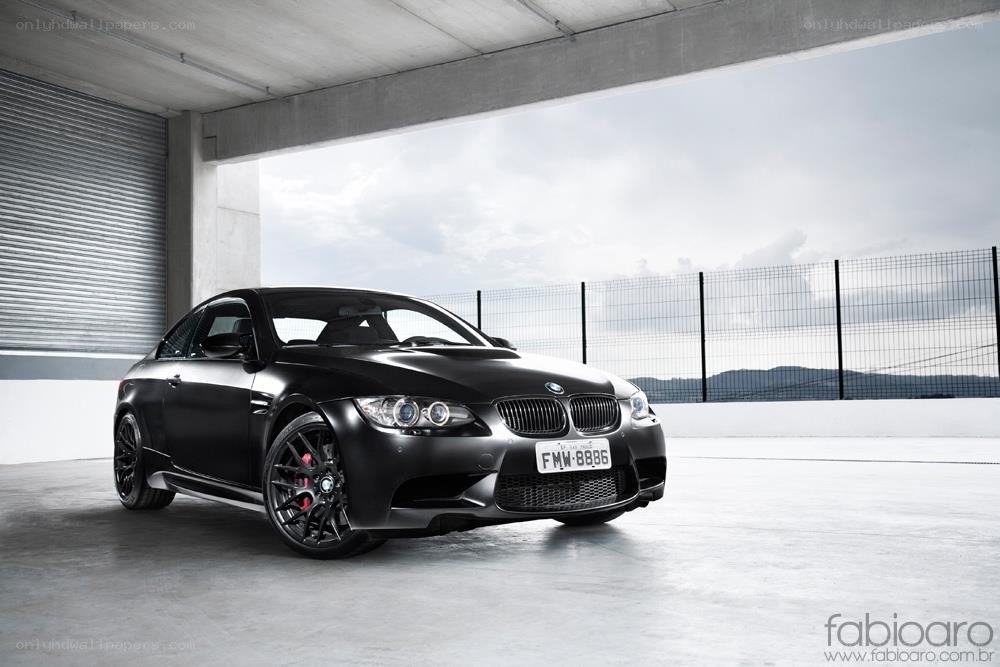 Black BMW M3 in a garage