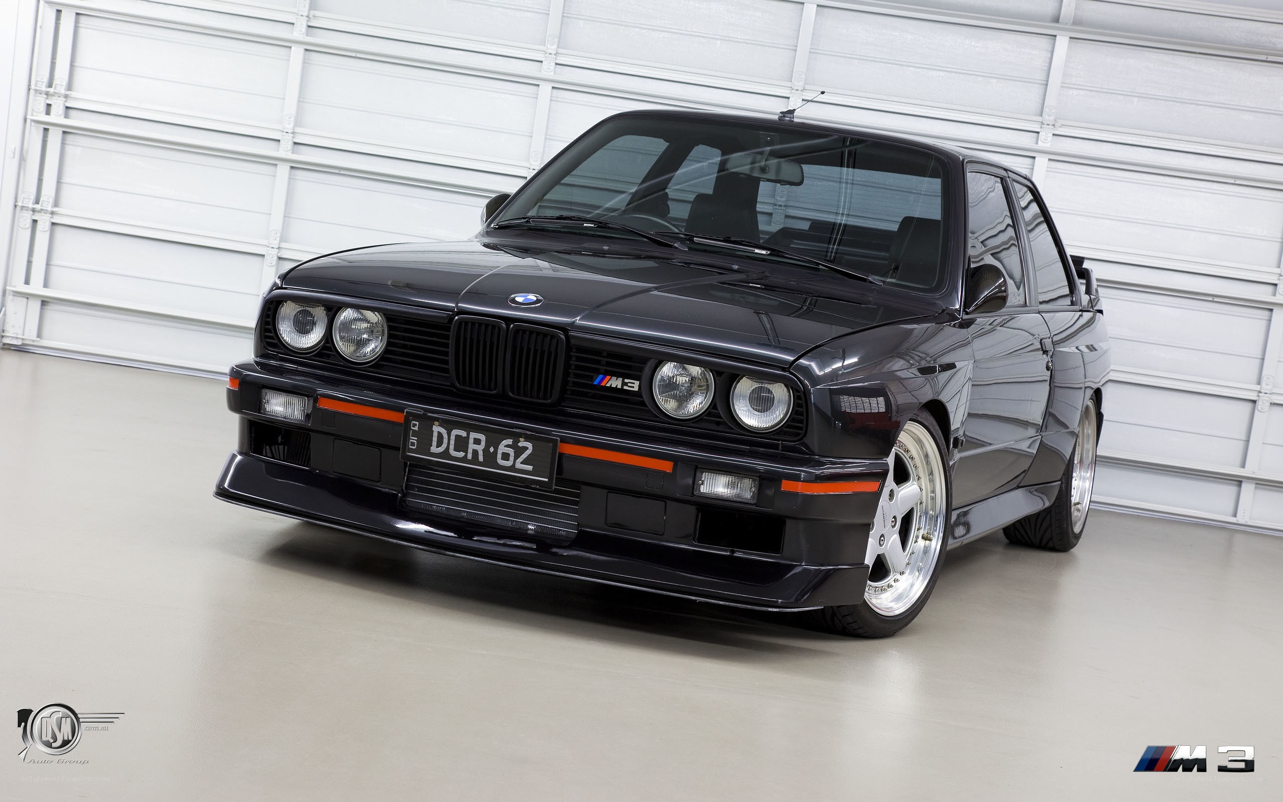 Black BMW M3 in garage