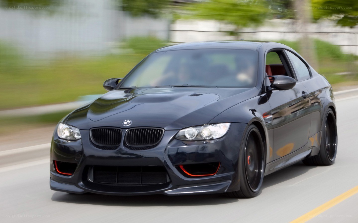 black bmw m3 in motion