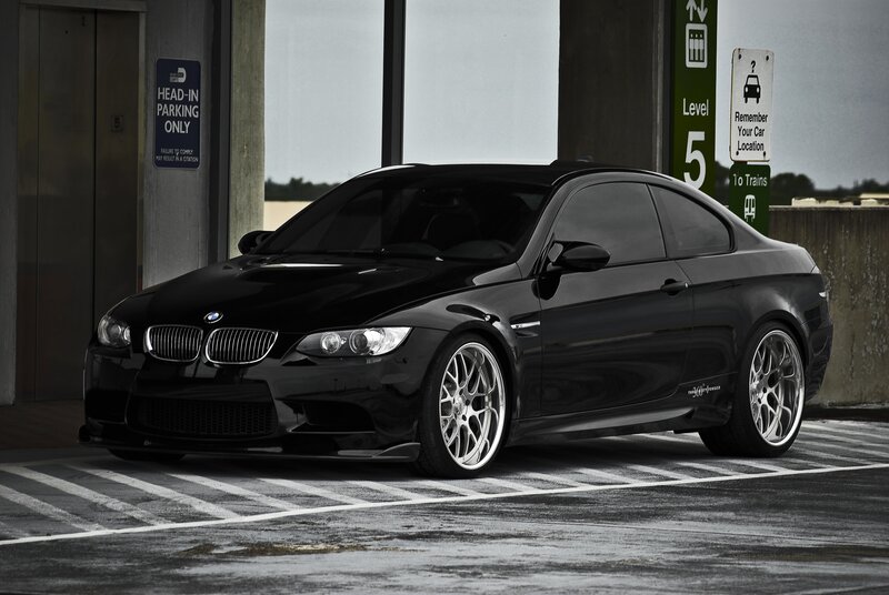 Black BMW M3 in parking garage