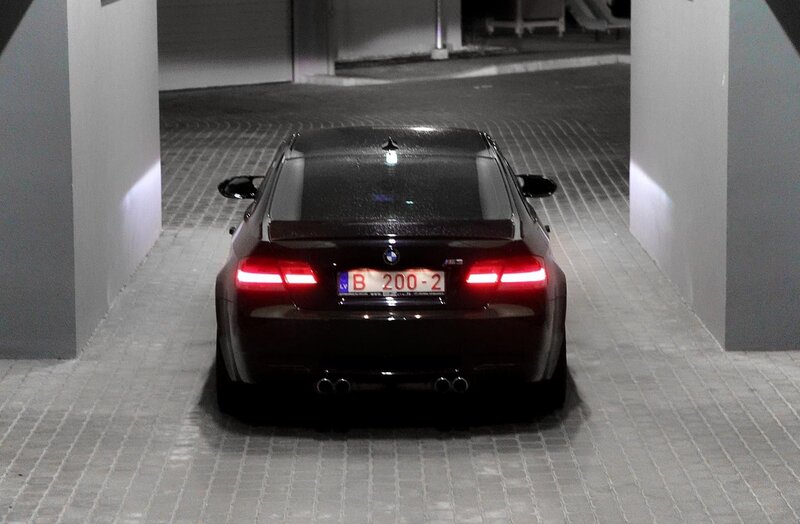 black bmw m3 in parking garage