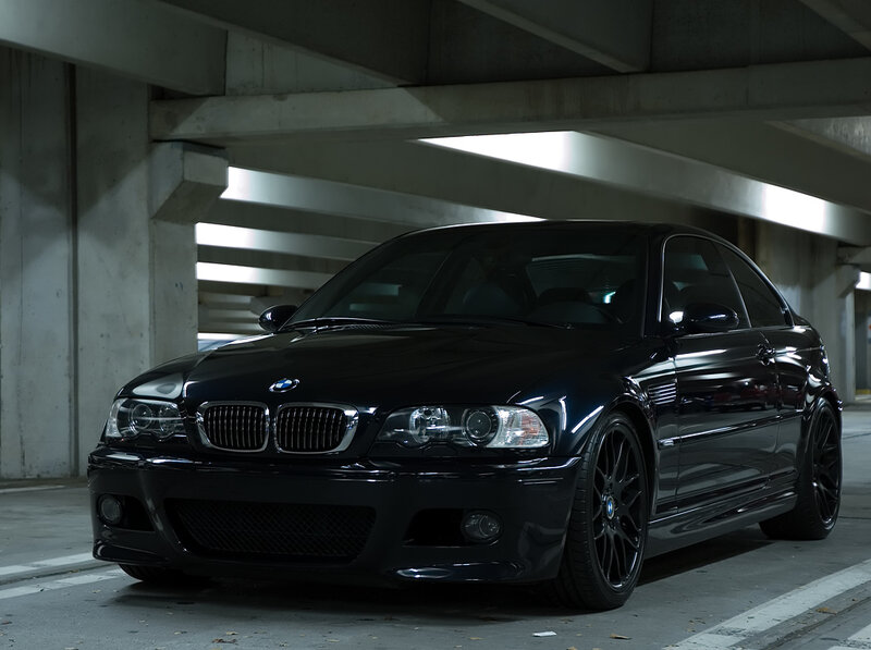 Black BMW M3 in parking garage