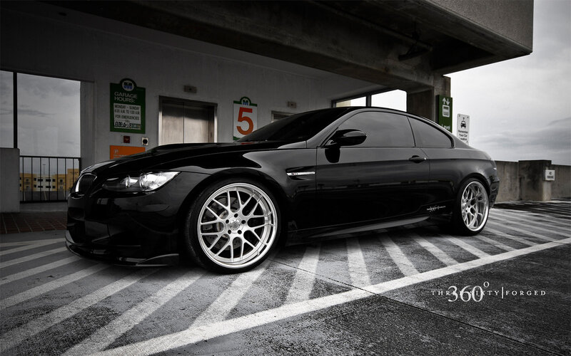 Black BMW M3 in parking garage