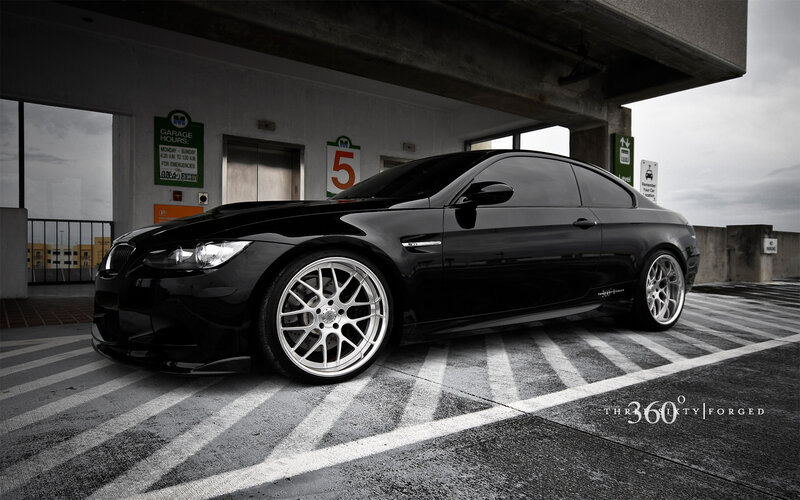 Black BMW M3 in parking garage