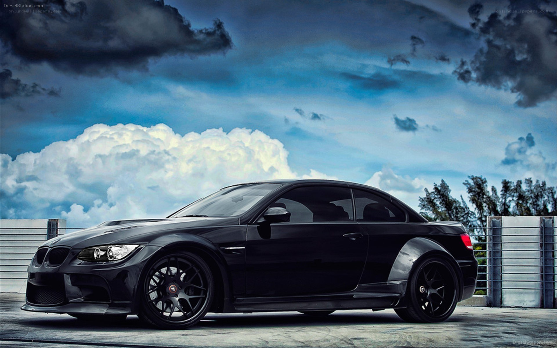 Black BMW M3 on a cloudy day