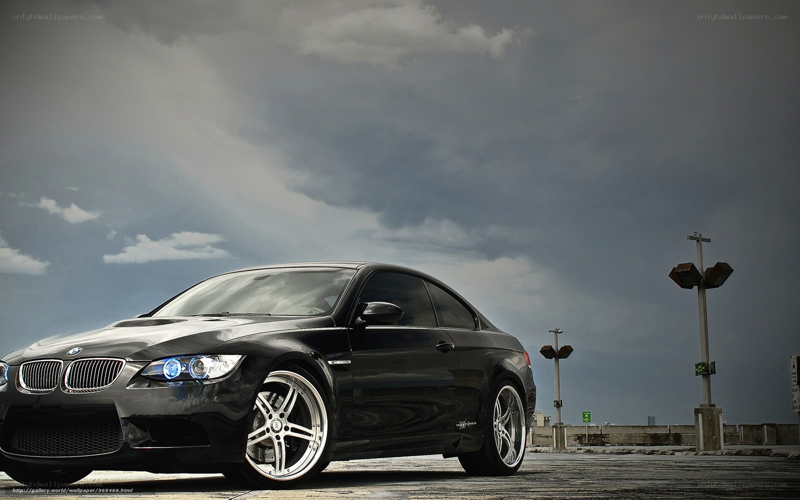 Black BMW M3 on a cloudy day