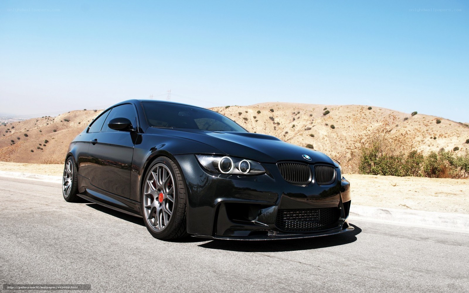 Black BMW M3 on a desert road
