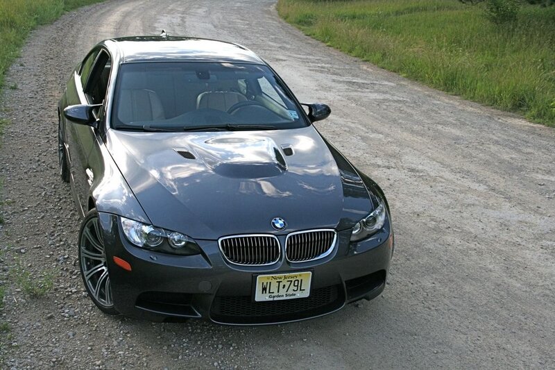 Black BMW M3 on a gravel road