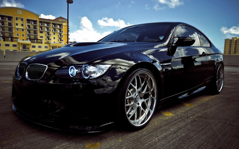 Black BMW M3 on a parking deck