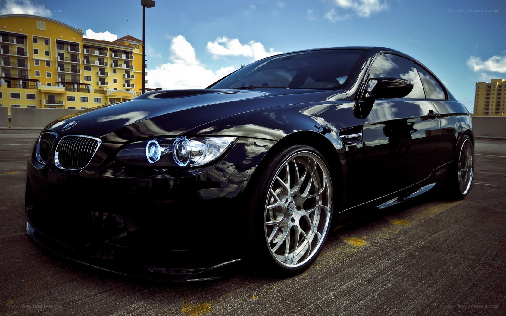 Black BMW M3 on a parking deck
