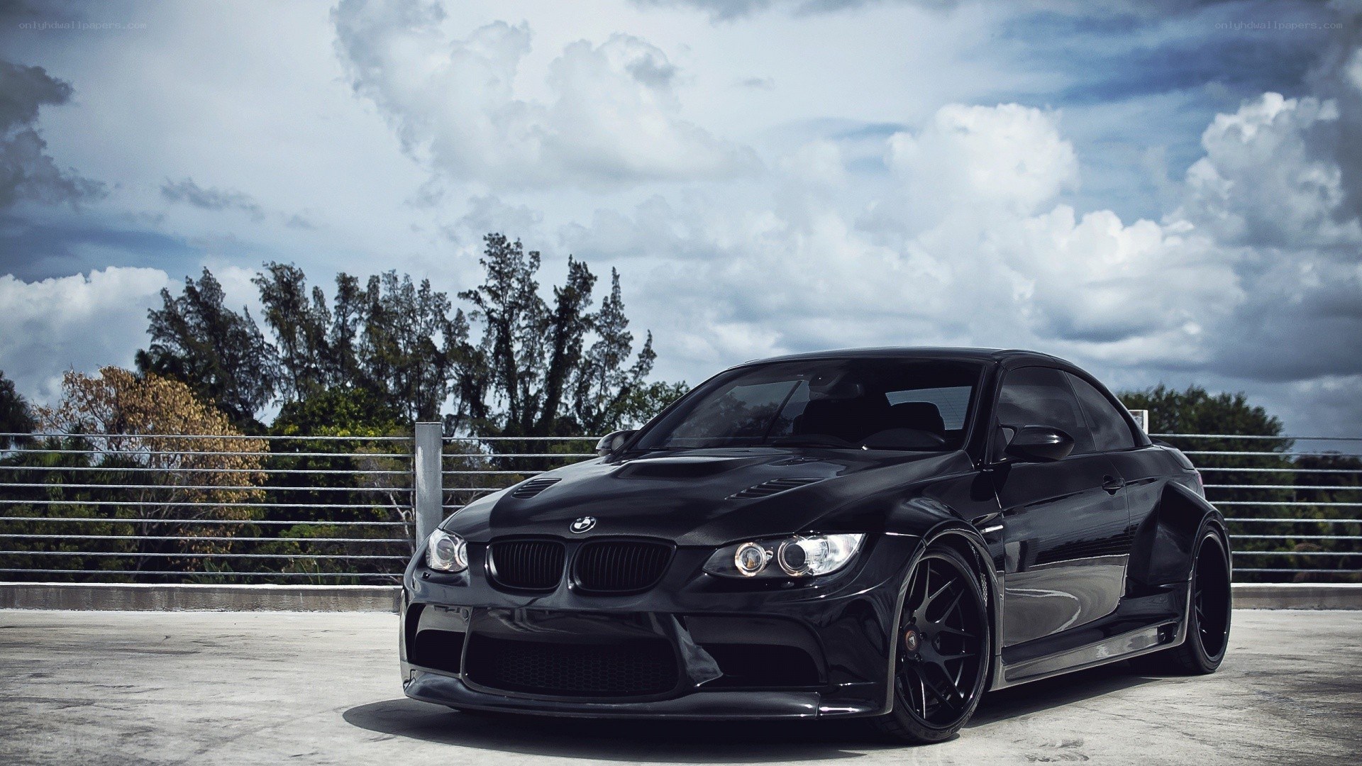 Black BMW M3 on a rooftop