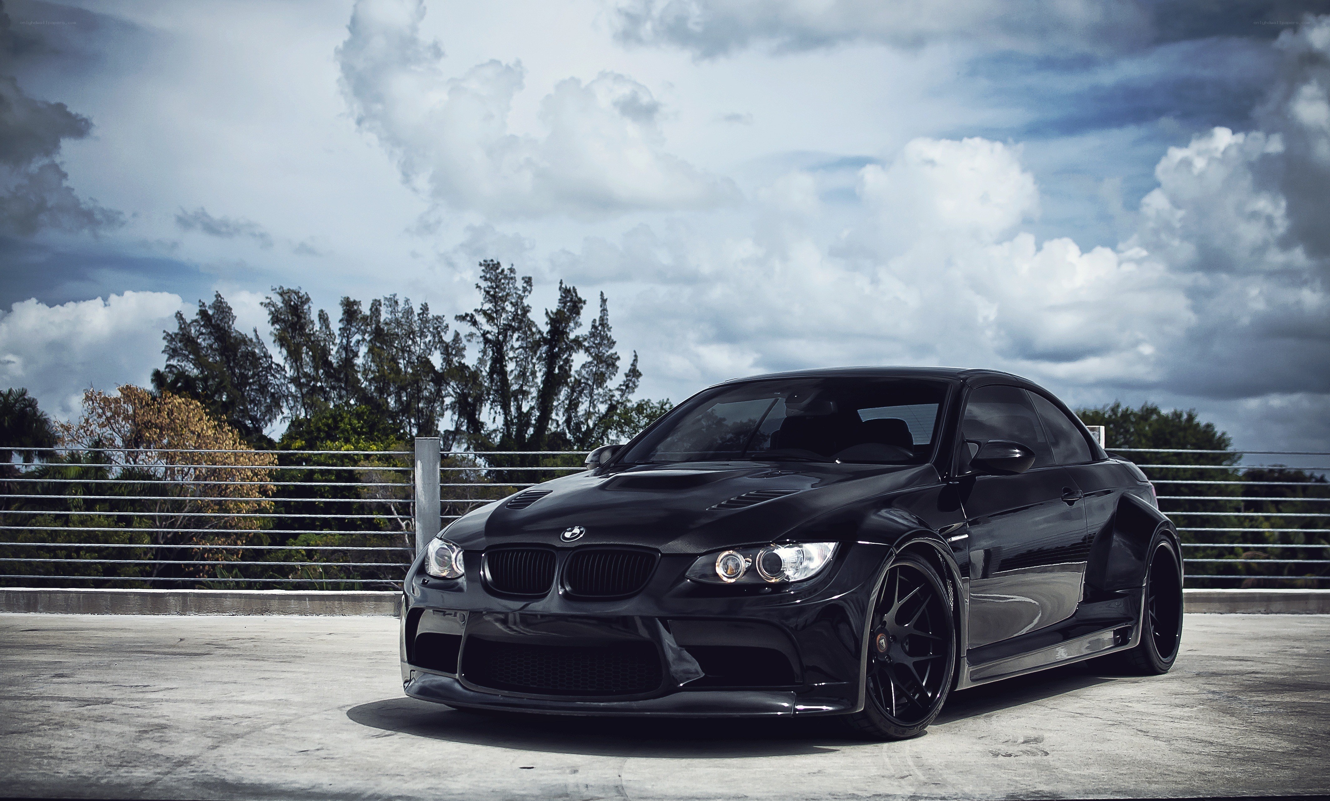 Black BMW M3 on a rooftop
