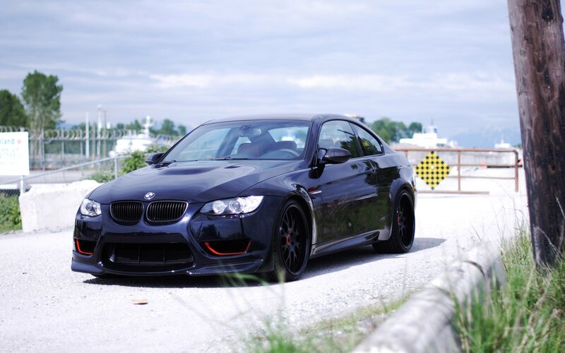 Black BMW M3 on gravel