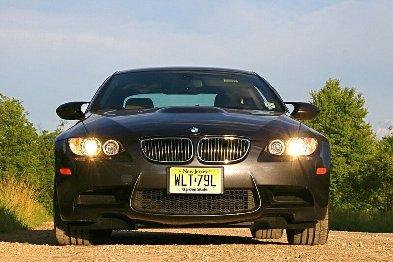 Black BMW M3 on gravel road