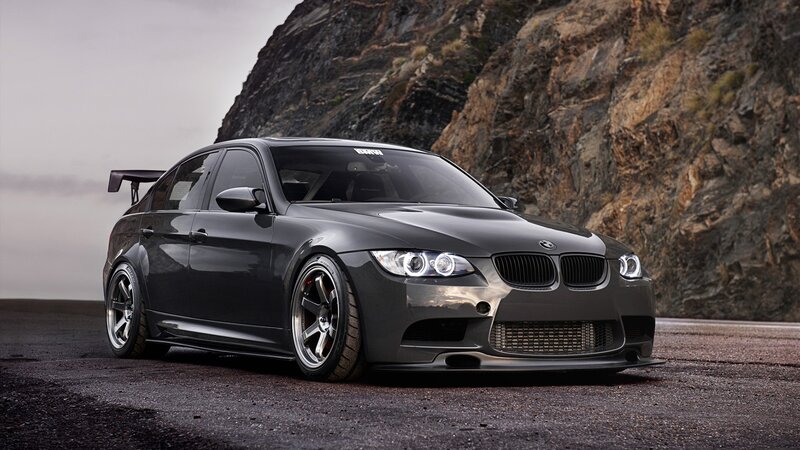 black bmw m3 on mountain road