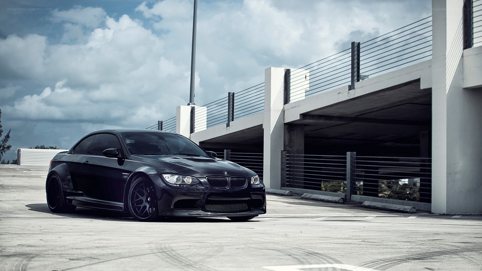 black bmw m3 on parking deck