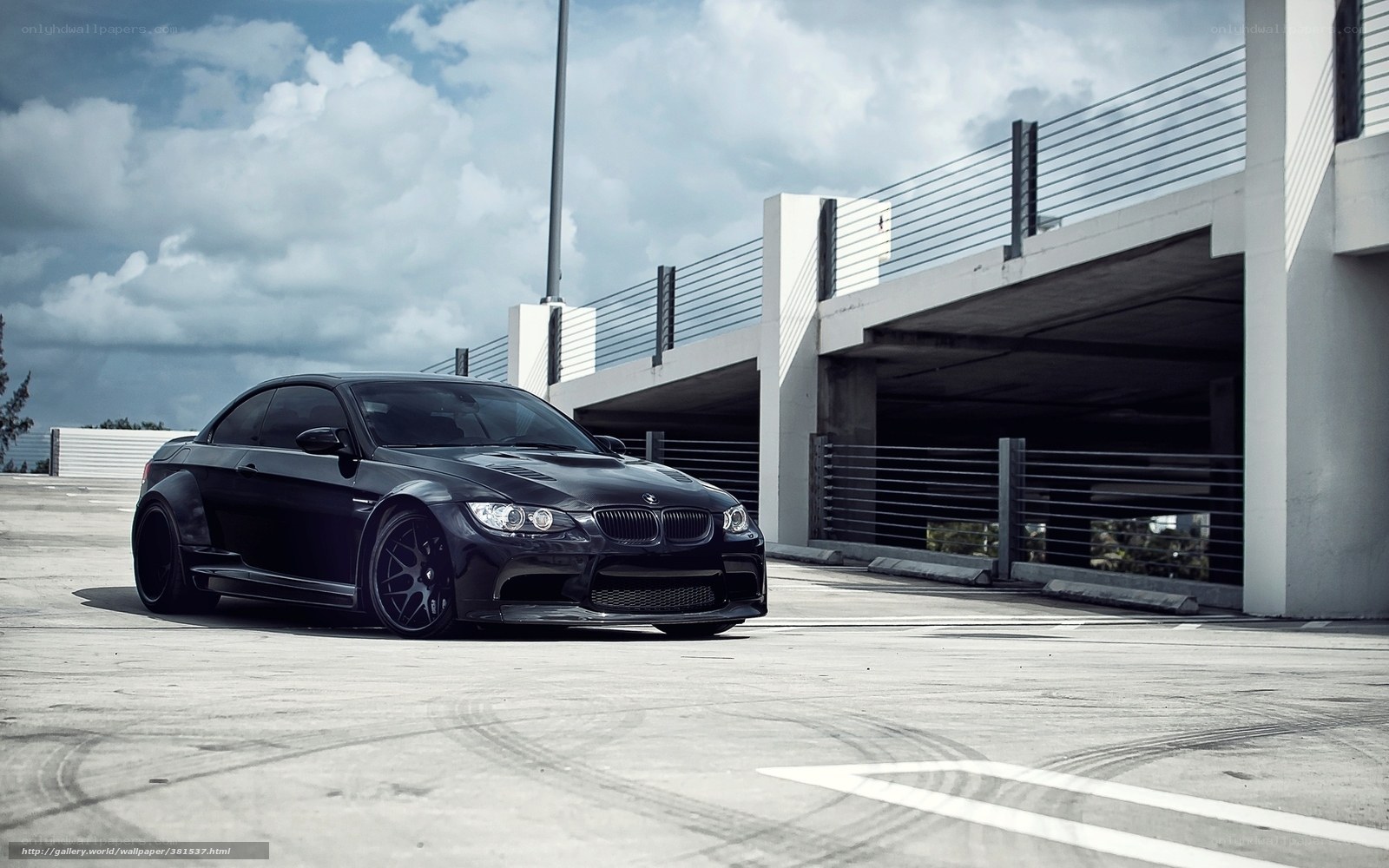 Black BMW M3 on parking deck