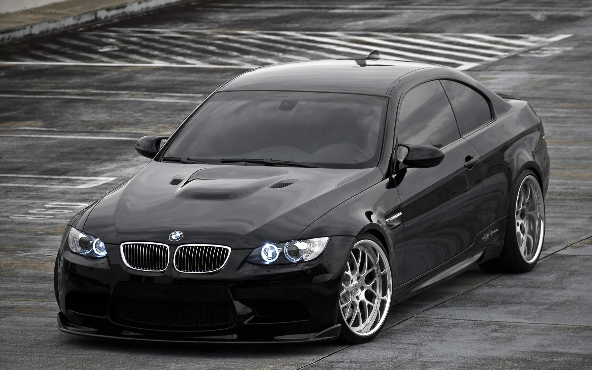 Black BMW M3 on racetrack