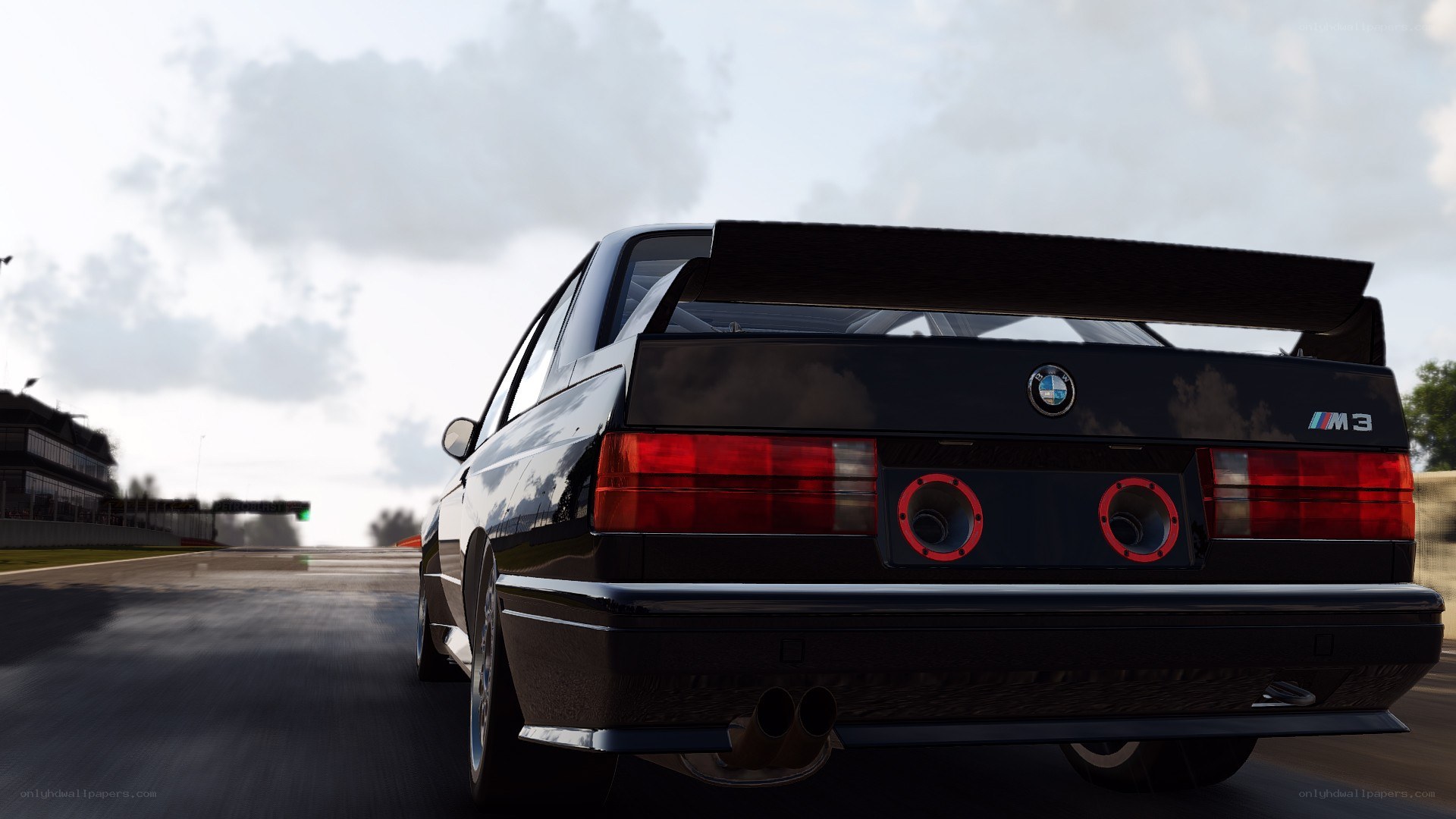 black bmw m3 on racetrack