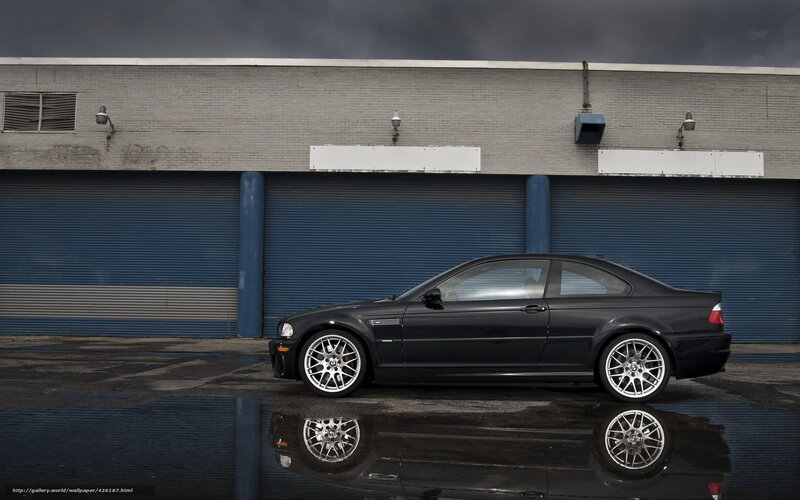 Black BMW M3 on wet pavement