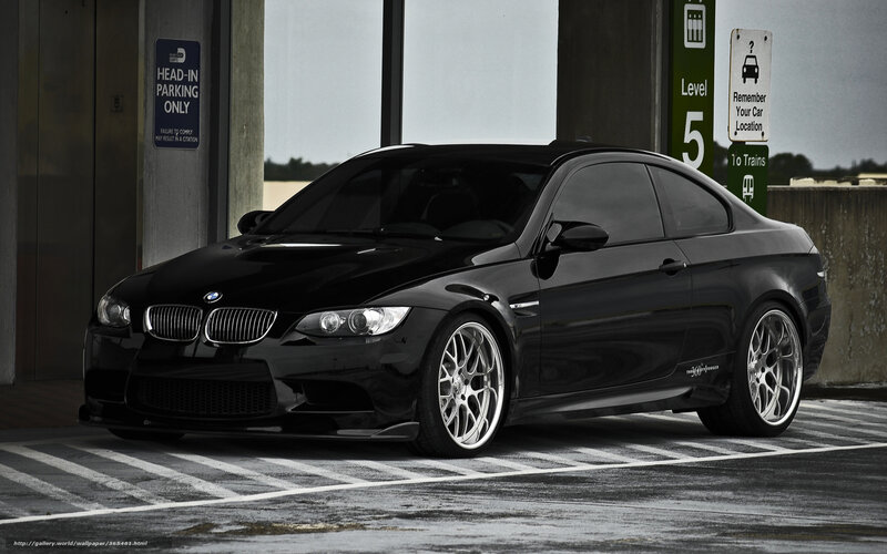 Black BMW M3 parked in garage
