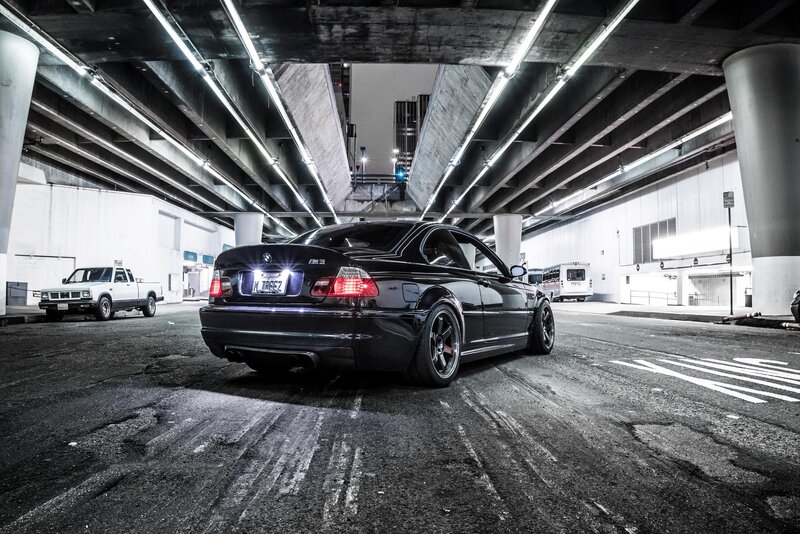 Black BMW M3 under an overpass