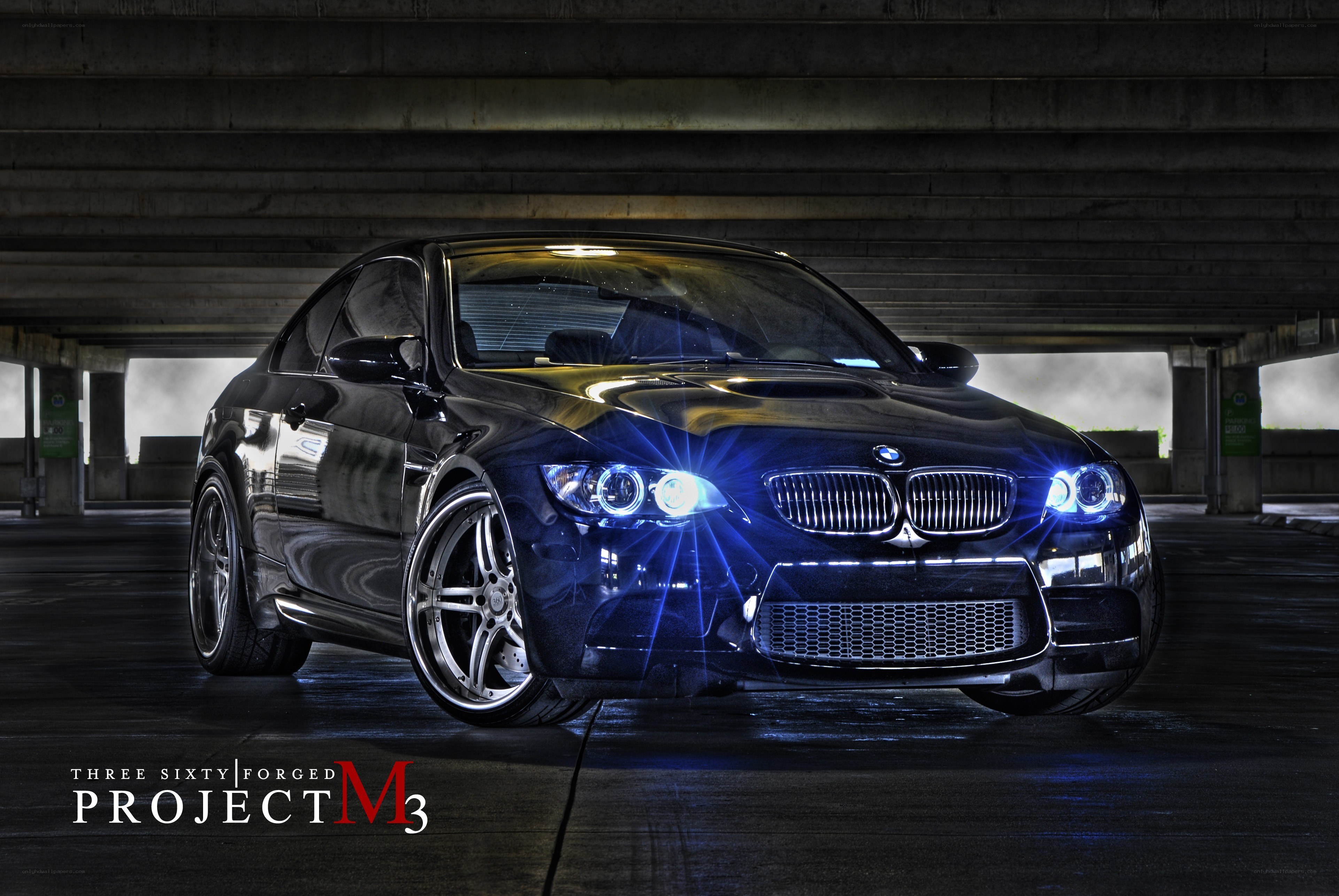 Black BMW M3 under overpass