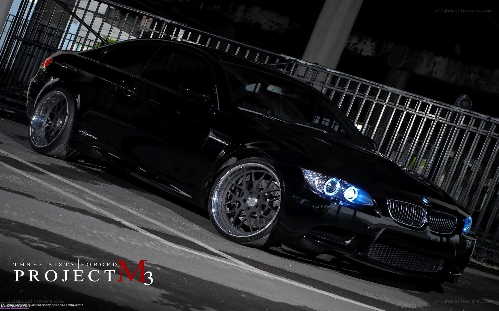 Black BMW M3 with blue headlights