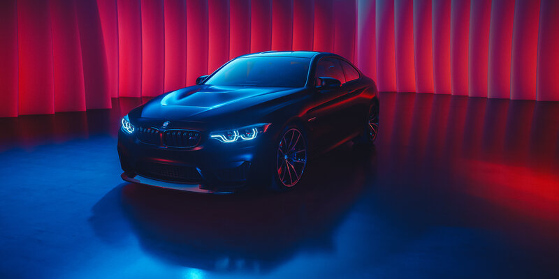 Black BMW M4 Coupe — Blue