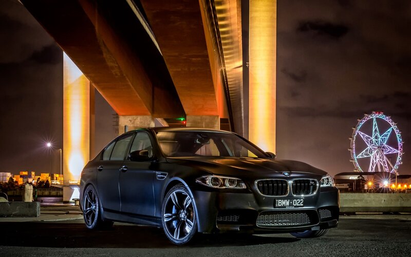 Black BMW M5 at night