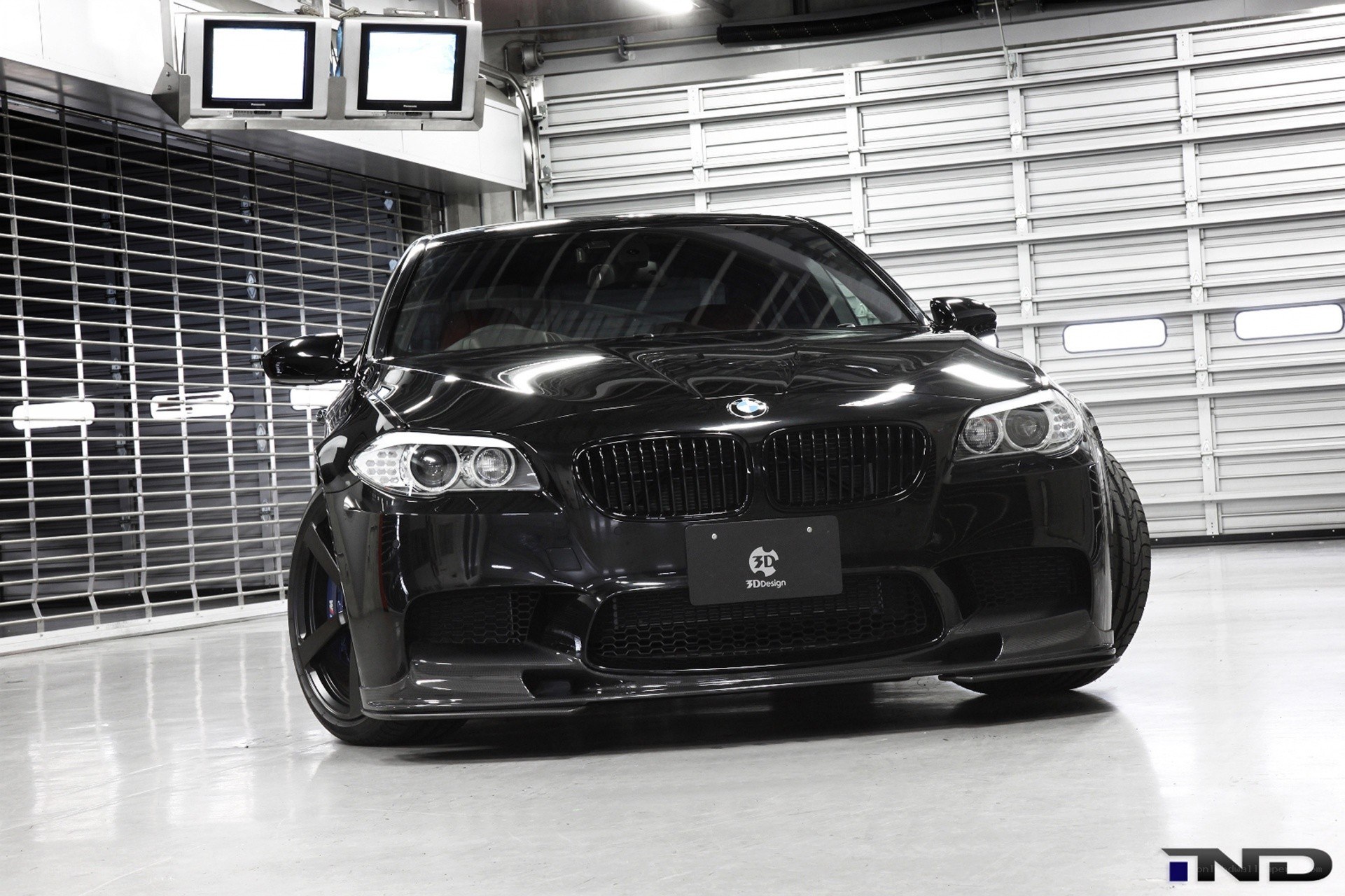 black bmw m5 in garage