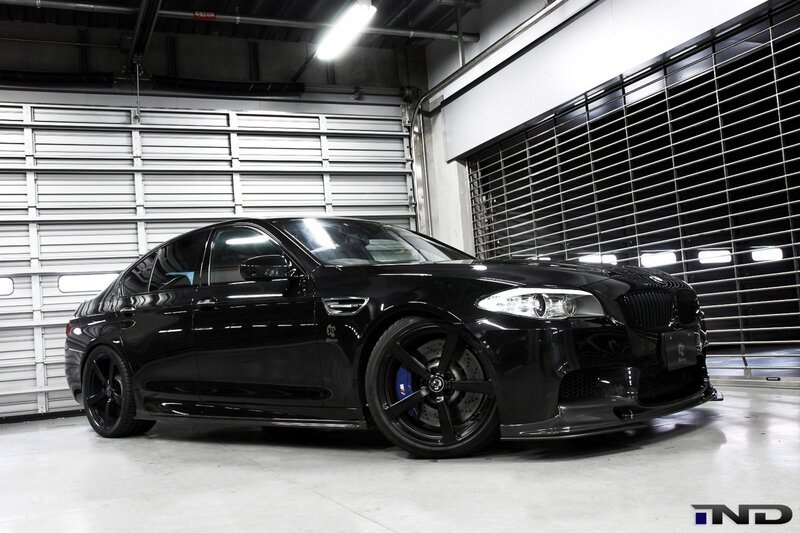 black bmw m5 in garage