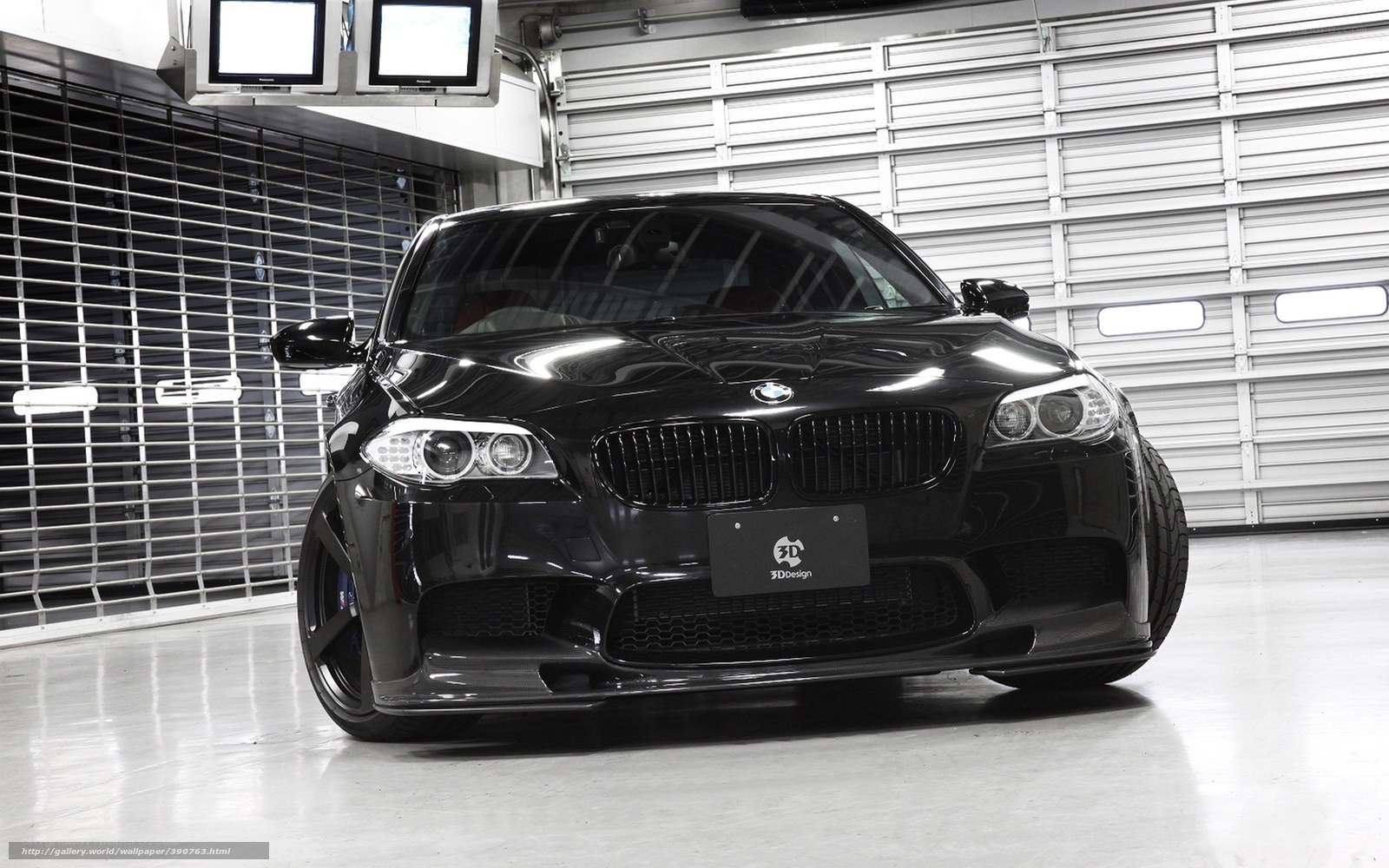 black bmw m5 in garage