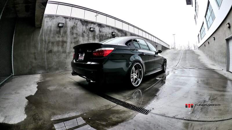 black bmw m5 in parking garage