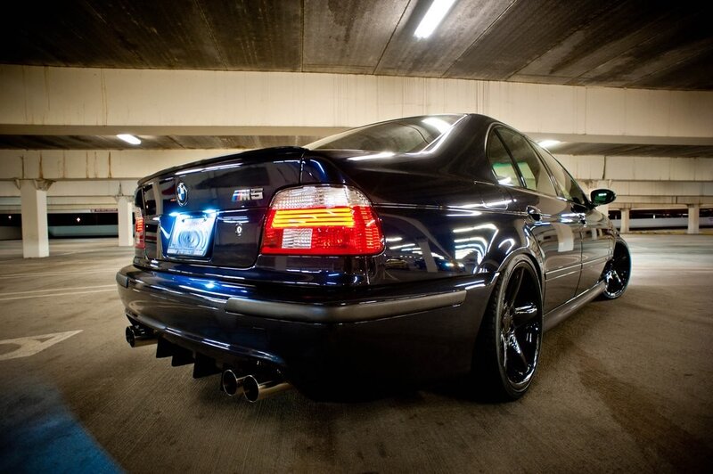black bmw m5 in parking garage