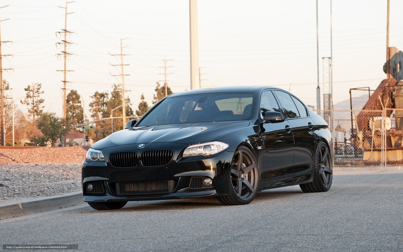 Black BMW M5 on a city street