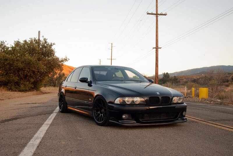 black bmw m5 on a road